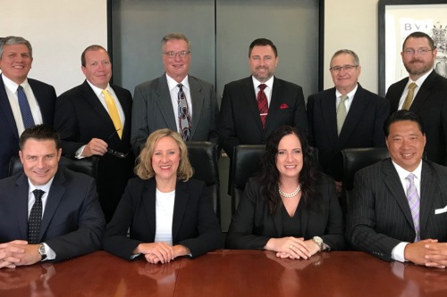 Scott A. Marquis with team
