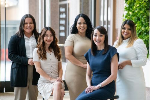 Elizabeth Villalpando Reed with team