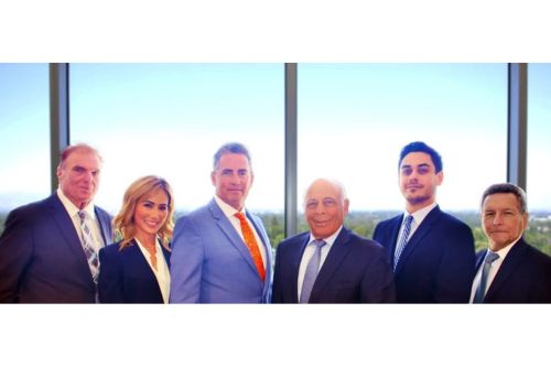 Leonard B. Levine with team