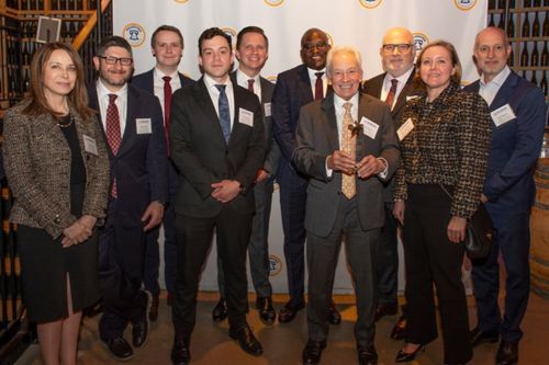 Alan M. Feldman with team