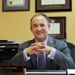 Adam E. Schramm