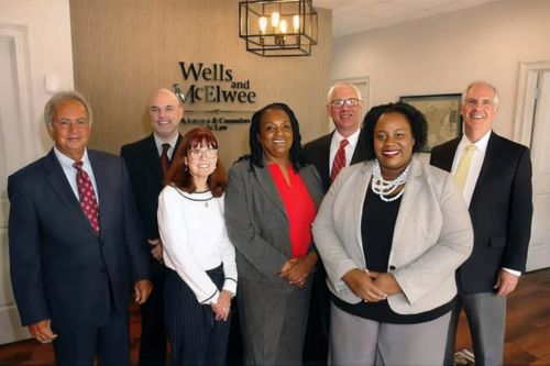 Donald T. Wells Jr. with team