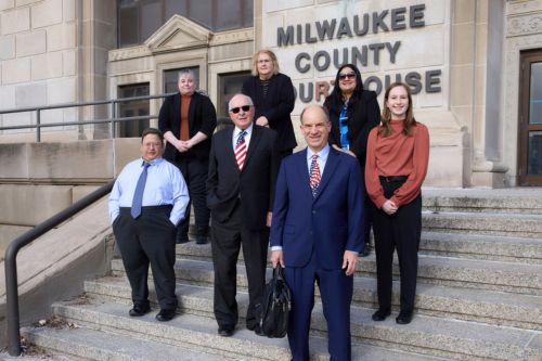Rick D. Steinberg with team