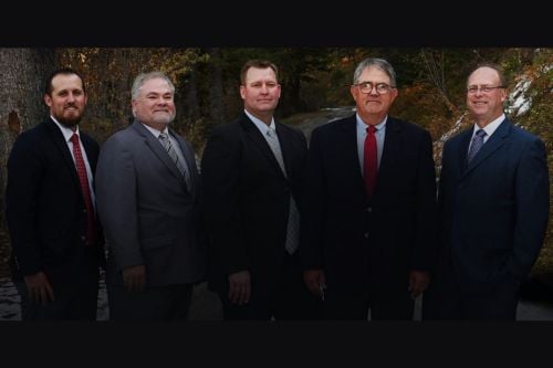 Peter M. Wells with team