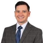 Travis J. Adams